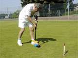 Mick playing
        croquet